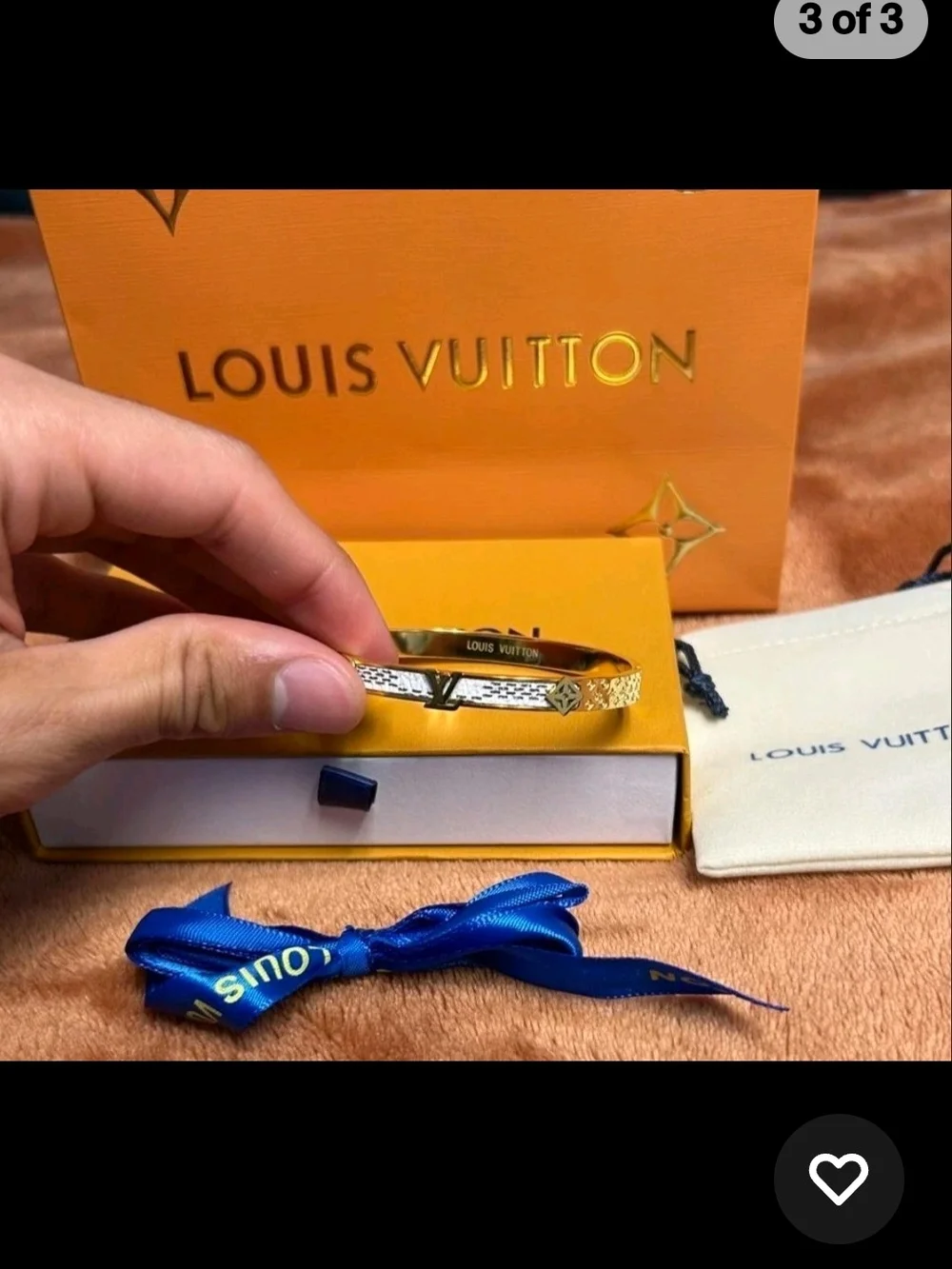 Louis Vuitton Gold Bracelet with Blue Ribbon Accent